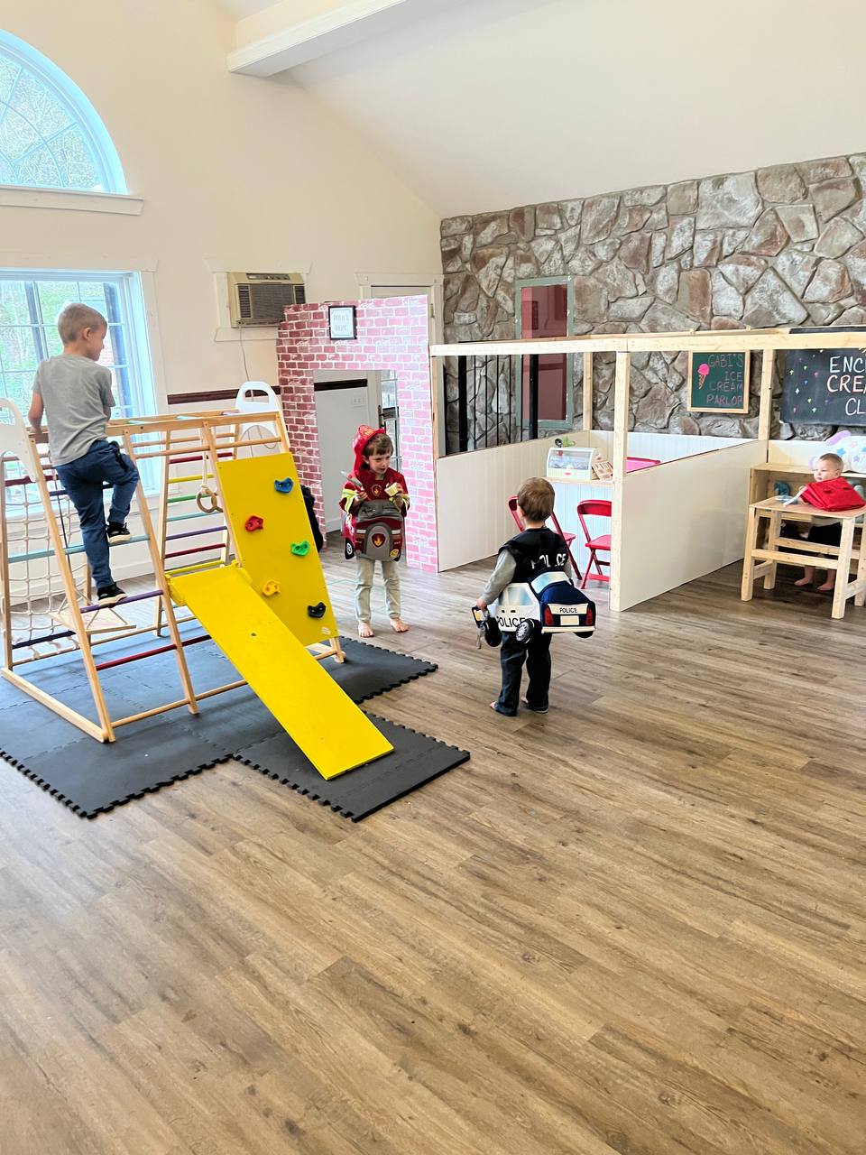 Kids playing in costumes at Storybook Settlement birthday party